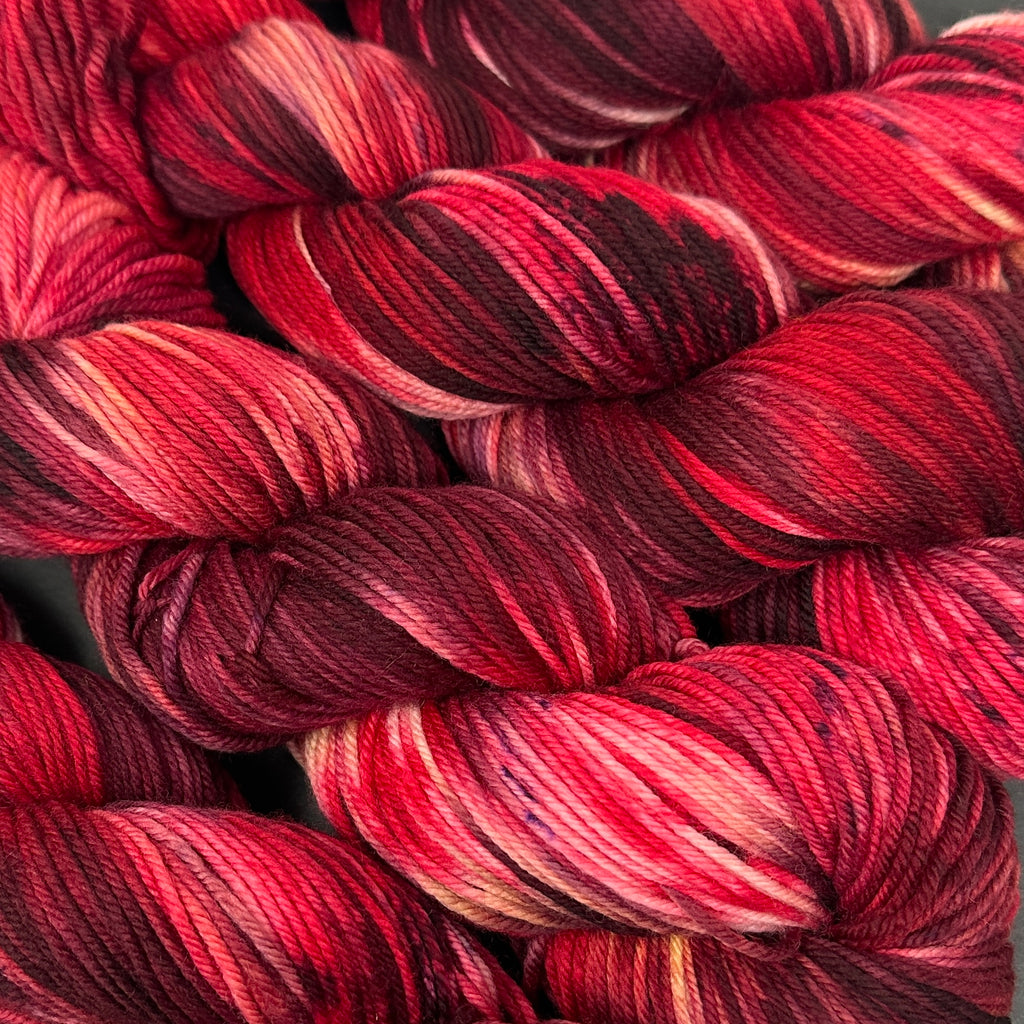 Still heavy DK to light worsted Ruby Red