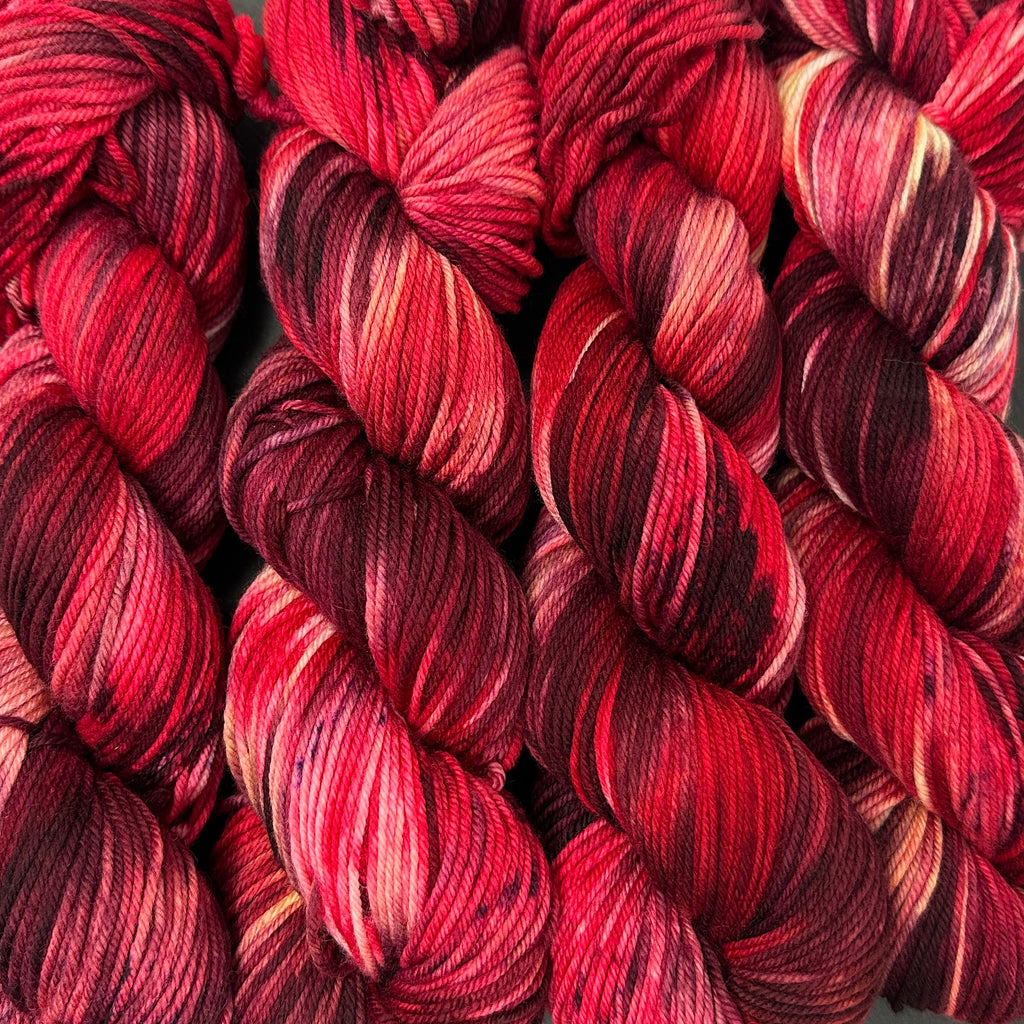Still heavy DK to light worsted Ruby Red