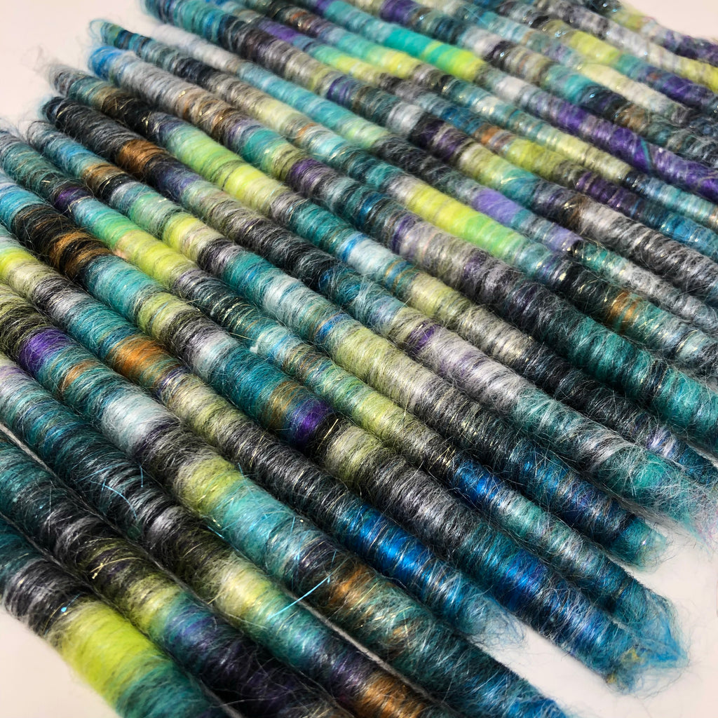 Punis for spinning yarn aqua with purple